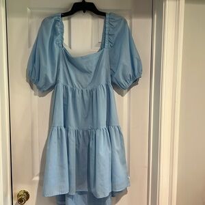 Light blue short sleeve blouse with cut out back and bow